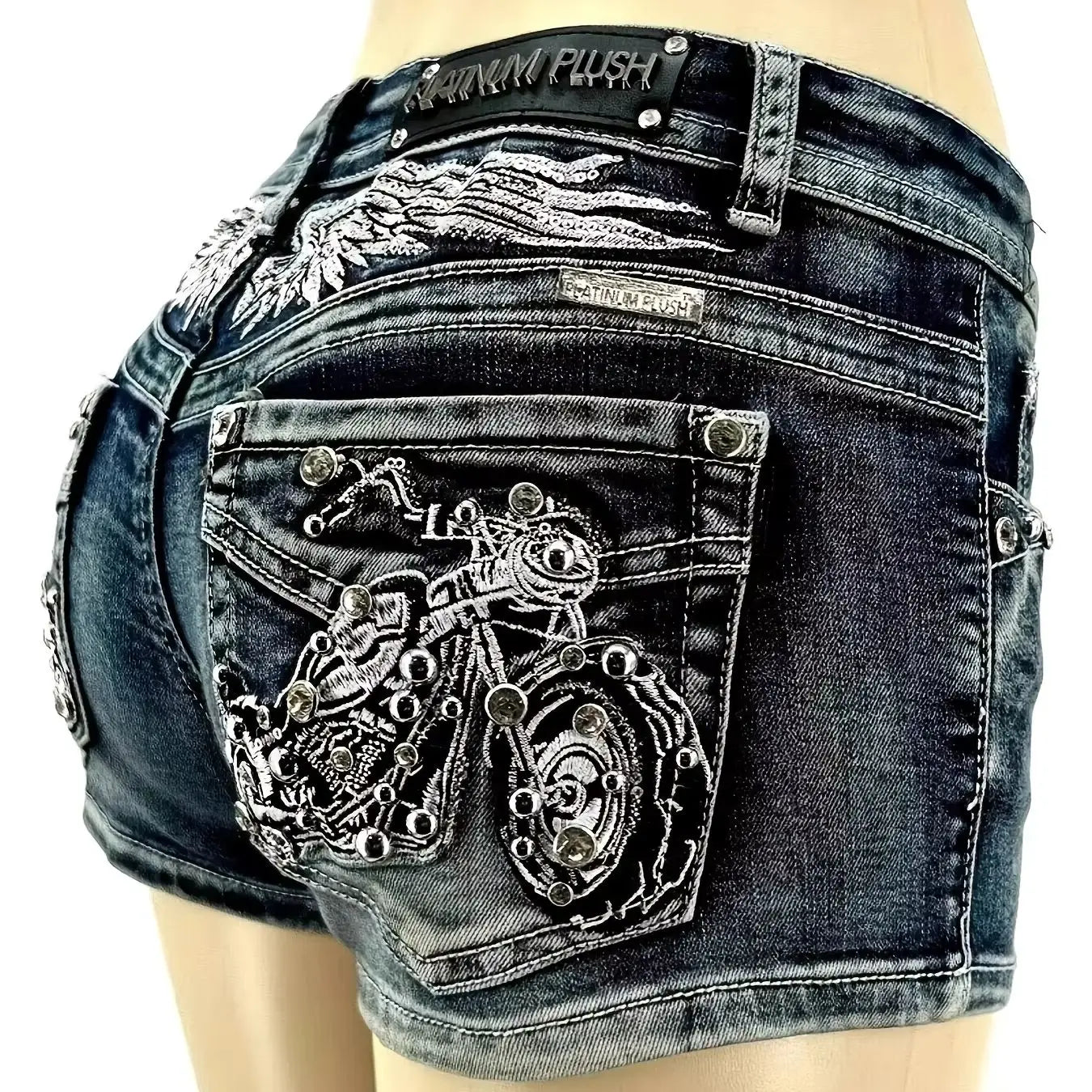 Y2K wing-embroidered studded denim shorts, low-rise slim fit, motorcycle-style embellishments on the back pockets, distressed washed finish, trendy and unique style.